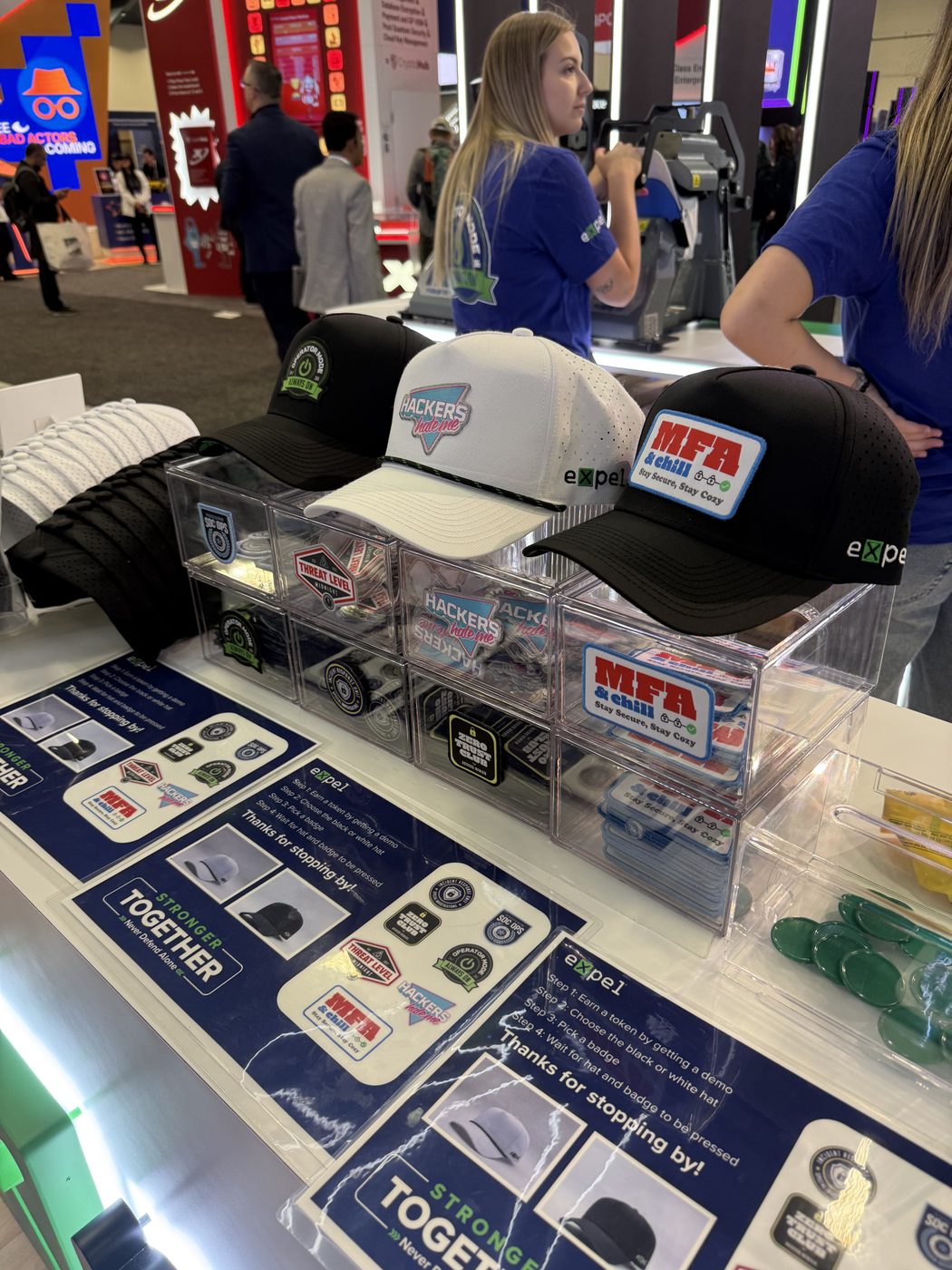 Hats and patch bins on the counter, with cards explaining how to earn a hat